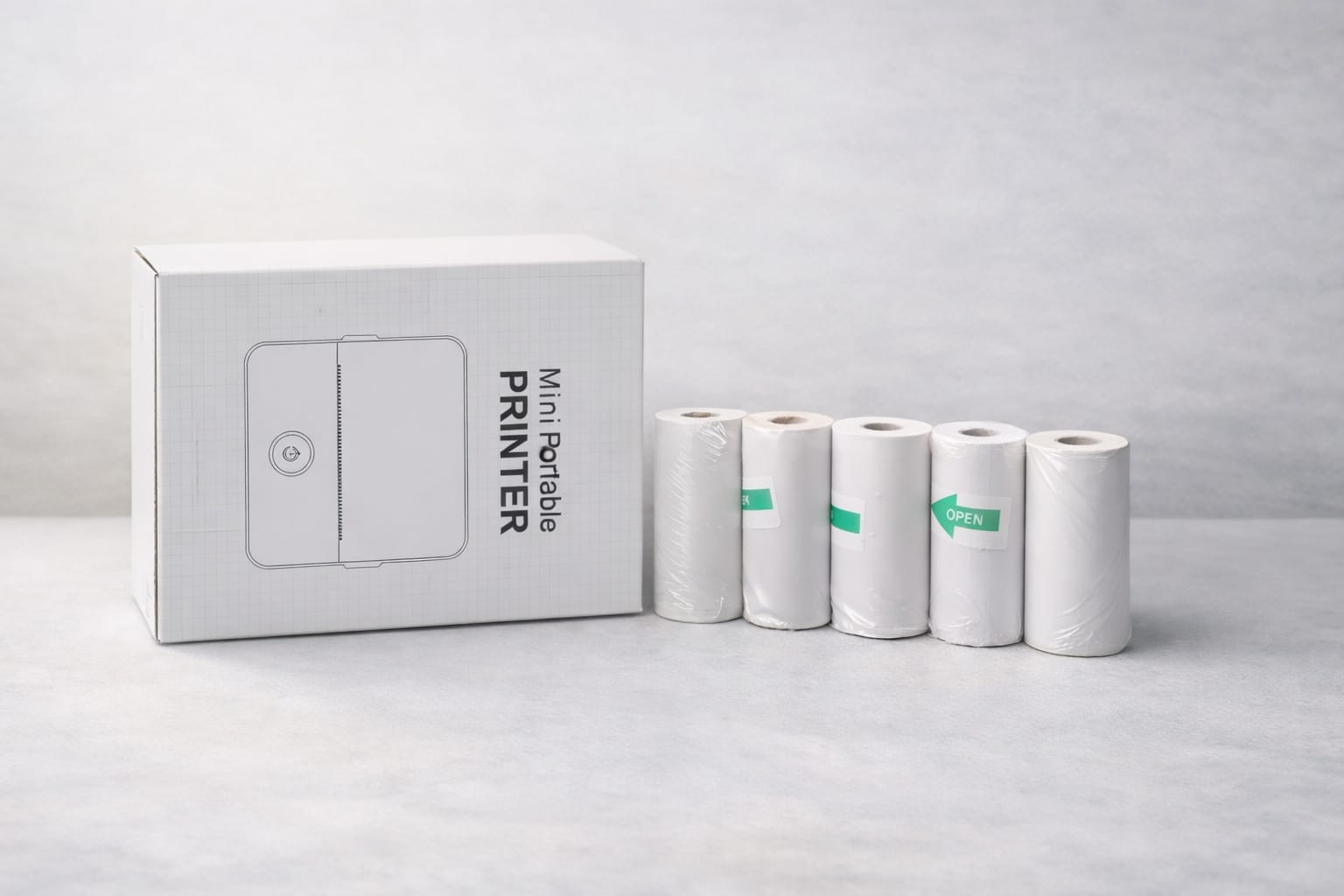 Package includes:

Printer
Charger
User manual
5 rolls sticker paper
5 rolls white paper